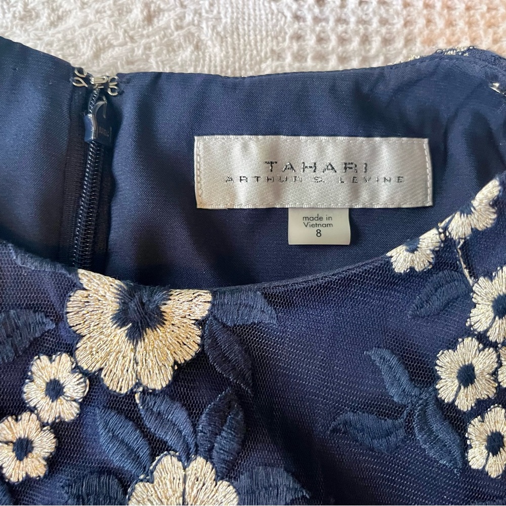 Tahari Elegant Sleeveless Dress with White Floral Embroidery over Deep Blue - Picture 9 of 14